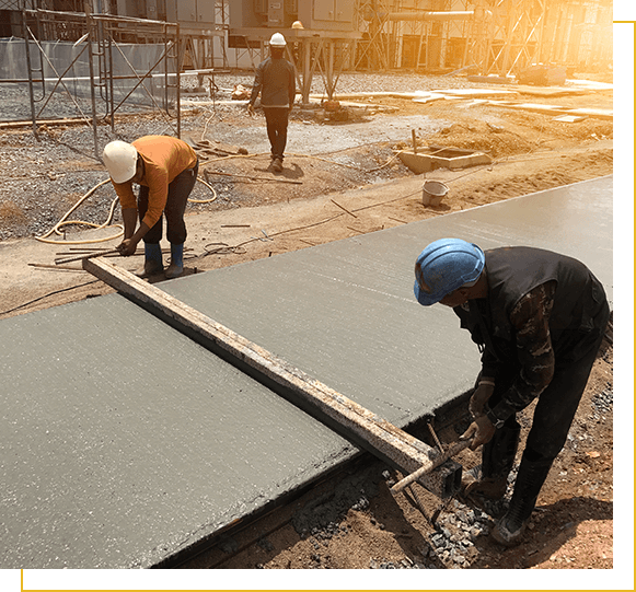 Two workers are using steel box on concrete slabs after pouring concrete,select focus and Light fair.Workers are leveling poured liquid concrete on a steel reinforcement to form strong floor slab.